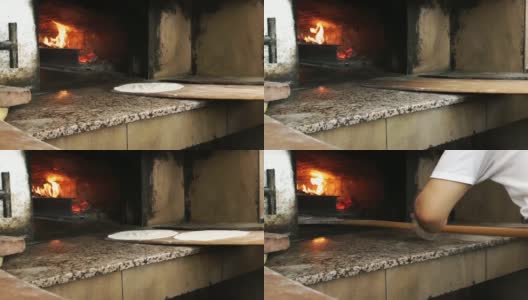 将土耳其披萨皮塔放入木质烤炉高清在线视频素材下载