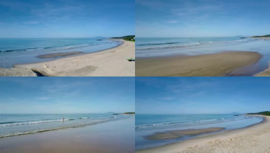 在宁静的天空下，沙滩女人去清洁的海洋高清在线视频素材下载