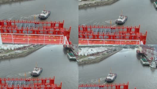 被拖船拖着的集装箱船，布宜诺斯艾利斯港，阿根廷，南美。从集装箱船的桥上看。高清在线视频素材下载