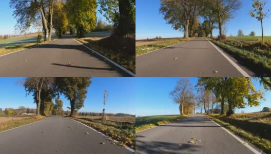 从汽车上看秋天的风景，秋天的乡村风景中的彩色树木和晴天的蓝天。高清在线视频素材下载