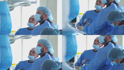 临床医学手术。专业医生用特殊设备为病人做手术。戴口罩的外科医生进行手术。高清在线视频素材下载