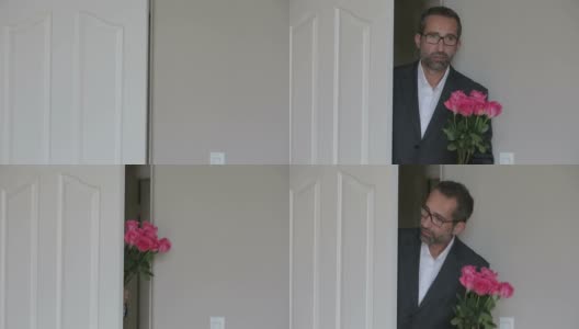 一个穿着西装，捧着一束花的男人从门口进来高清在线视频素材下载