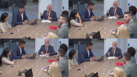 一位男性高级CEO在董事会会议室与他的多种族员工举行会议高清在线视频素材下载