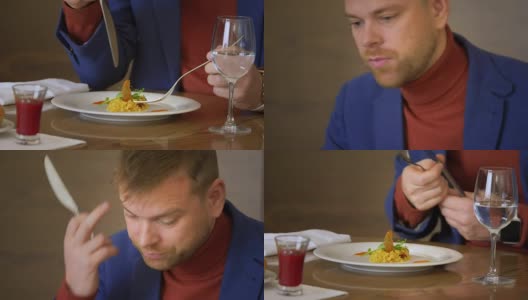 一名年轻人在餐馆用餐时用刀叉打烊高清在线视频素材下载