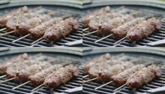 烤制美味的串肉串。高清在线视频素材下载