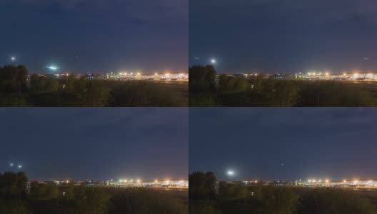 间隔拍摄。北京首都国际机场夜间航站楼，飞机降落，中国。高清在线视频素材下载