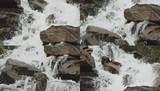 在慢镜头中，山涧的水从岩石和巨石上倾泻而下高清在线视频素材下载