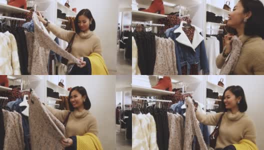 亚洲女人在商场购物，买圣诞礼物，买衣服(所有品牌都模糊了)高清在线视频素材下载