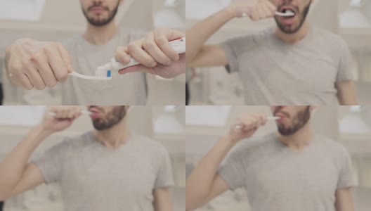 男人把牙膏挤在牙刷上高清在线视频素材下载