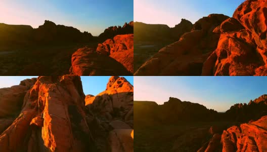 在日落时分，空中降落在充满活力的砂岩山峰上高清在线视频素材下载