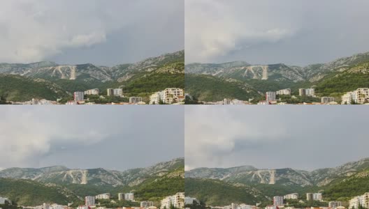 时光流逝，黑山布达瓦附近的贝奇市的亚得里亚海海岸线，快速移动的雨云高清在线视频素材下载