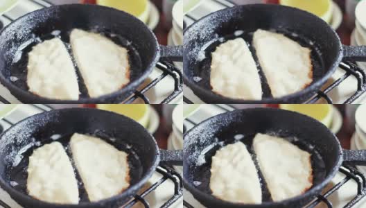 用葵花籽油在煎锅里炸肉饼高清在线视频素材下载