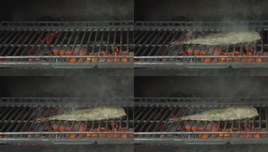 厨师在餐厅的烤架上烹饪鱼高清在线视频素材下载