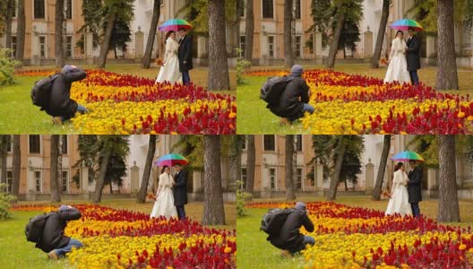 摄影师在给一对新婚夫妇拍照高清在线视频素材下载