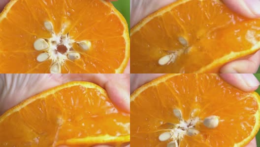 榨取橙子的慢动作。高清在线视频素材下载
