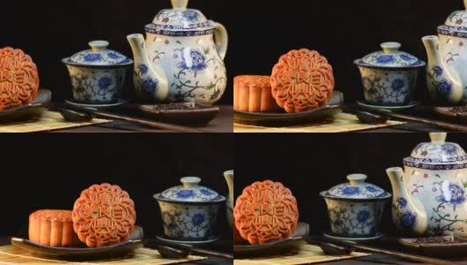 中秋节期间向朋友或家人聚会赠送月饼/月饼/月饼上的汉字在英语中代表“双白”高清在线视频素材下载