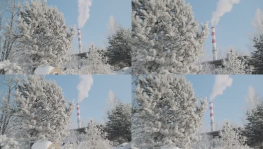 工厂的烟囱在冰天雪地里冒烟高清在线视频素材下载