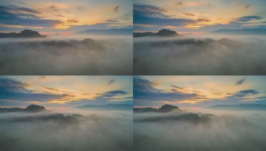 超高延时视频4k，鸟瞰图美丽的晨光日出和薄雾在高山上流动。高清在线视频素材下载