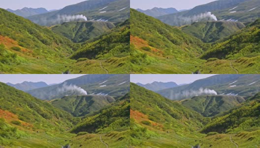 间歇泉和生态旅游支柱的蒸汽以上绿色山阿夫基高清在线视频素材下载