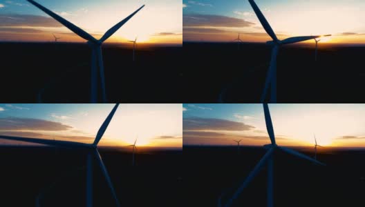 日出时，早晨的阳光穿过德克萨斯州中部的风力发电场高清在线视频素材下载