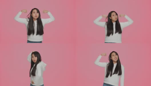自信的亚洲女孩展示力量和力量，举起手臂展示二头肌，亲吻肌肉自豪的成就高清在线视频素材下载