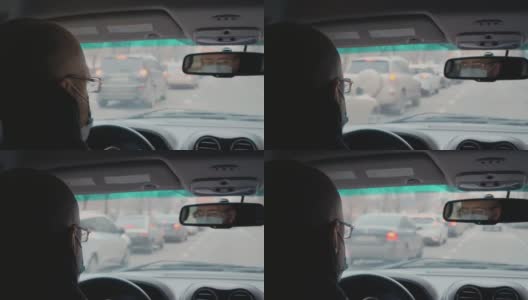 中年男子带着医用口罩，忙着开车去办公室高清在线视频素材下载