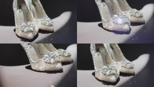 白色蕾丝设计师鞋的女人站在室内闪亮的宝石石头的慢动作。女婚礼鞋等公主黑色背景接近复制空间。新娘的时尚高清在线视频素材下载