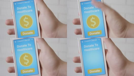 一名男子通过智能手机上的慈善应用为医疗机构在线捐款高清在线视频素材下载