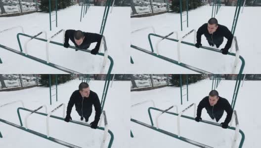 在雪地里做俯卧撑的男人高清在线视频素材下载
