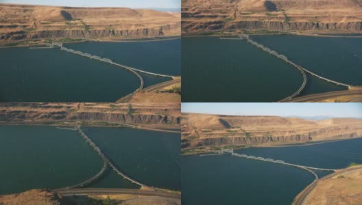 俄勒冈州(约2021年):沿哥伦比亚河峡谷的俄勒冈州主干线铁路桥鸟瞰图。用直升机用RED 8K拍摄的Cineflex。高清在线视频素材下载