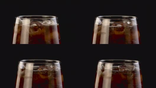 苏打(可乐)被倒进冰4K视频的普通玻璃杯高清在线视频素材下载