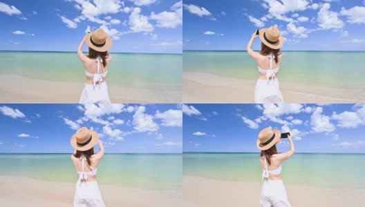 穿着比基尼的女人用智能手机拍摄蓝天和热带海滩高清在线视频素材下载
