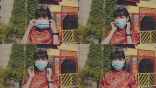 中国妇女戴着防护面具微笑高清在线视频素材下载