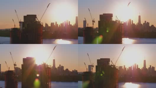 布鲁克林滨水区新建住宅楼，日落时分，可以看到曼哈顿下城的天际线和自由塔的美景。航拍视频与平移摄像机运动。高清在线视频素材下载