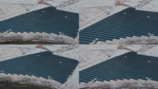 俯视图现代太阳能电池板站位于野外与雪在寒冷的冬天天气高清在线视频素材下载