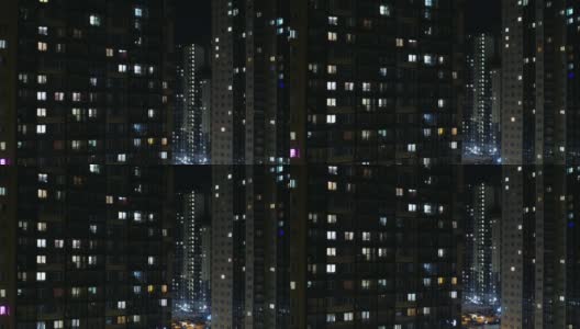 夜晚窗户下，摩天大楼闪烁着全景高清在线视频素材下载