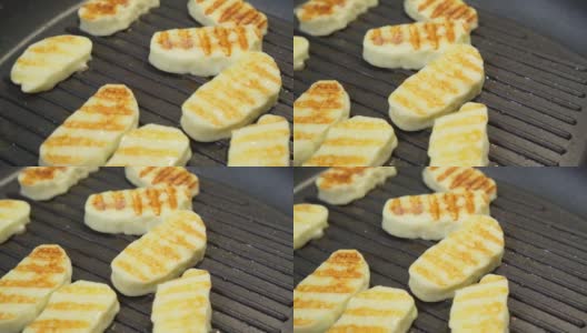 塞浦路斯halloumi奶酪。烤奶酪，在烤盘上烤奶酪高清在线视频素材下载