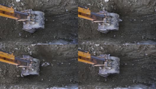 近距离观看挖掘机在地下挖掘高清在线视频素材下载