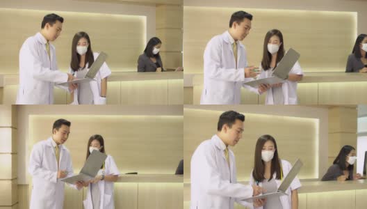4K专业的亚洲男女医生在医院或医疗机构大厅讨论病人症状的诊断和康复治疗。医疗医院和保健设施的服务理念。高清在线视频素材下载