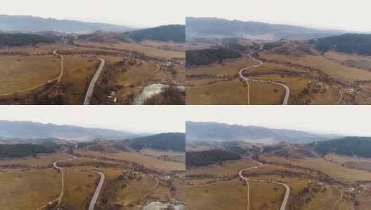 冬日里，一架无人机在山谷上空盘旋高清在线视频素材下载