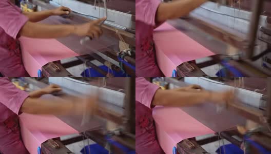 近距离的工人在木制编织线机制作传统泰国纺织丝绸制造高清在线视频素材下载