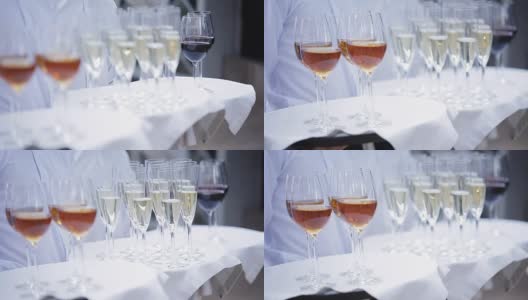 服务员用酒精饮料迎接客人。有香槟，红酒，白葡萄酒。高清在线视频素材下载