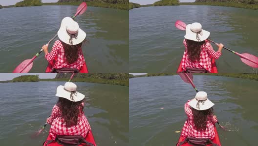 女人划着皮划艇在美丽的泻湖行动摄像POV女孩坐在皮划艇上高清在线视频素材下载