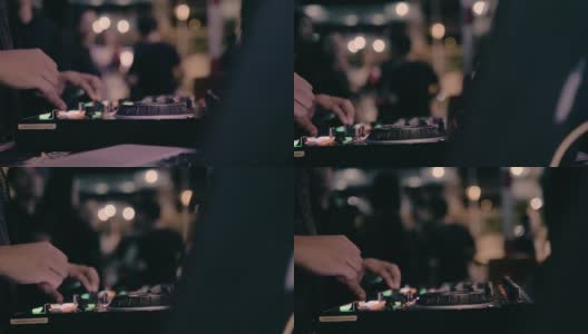 近距离的DJ手混合的轨道在夜总会在派对的舞台上高清在线视频素材下载