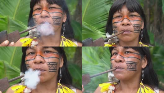 在巴西抽烟斗的土著妇女高清在线视频素材下载