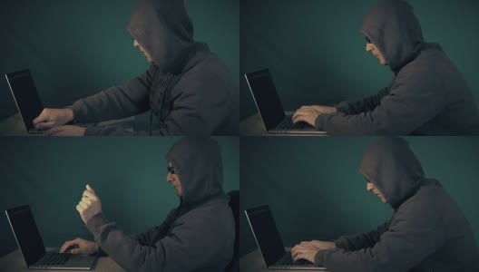 程序员戴着帽子和眼镜在笔记本电脑键盘上打字。黑客写的备忘录。男人用手做手势。低调的侧视图黑客坐在桌子前的笔记本电脑。高清在线视频素材下载