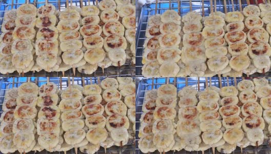 街头小吃:在泰国夜市卖烤香蕉串高清在线视频素材下载