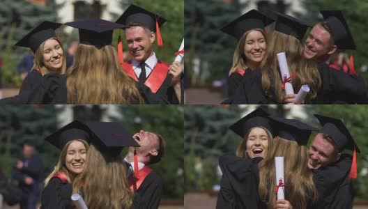 朋友们身着学术礼服的毕业生们互相祝贺、拥抱高清在线视频素材下载