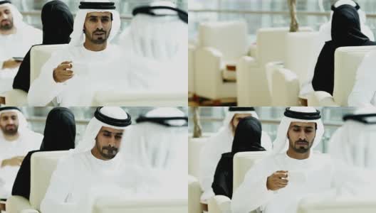 阿联酋的男性女性企业高管使用平板电脑开会高清在线视频素材下载
