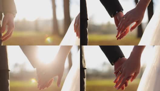 婚礼夫妇牵手在日落背景拍摄慢动作近距离高清在线视频素材下载